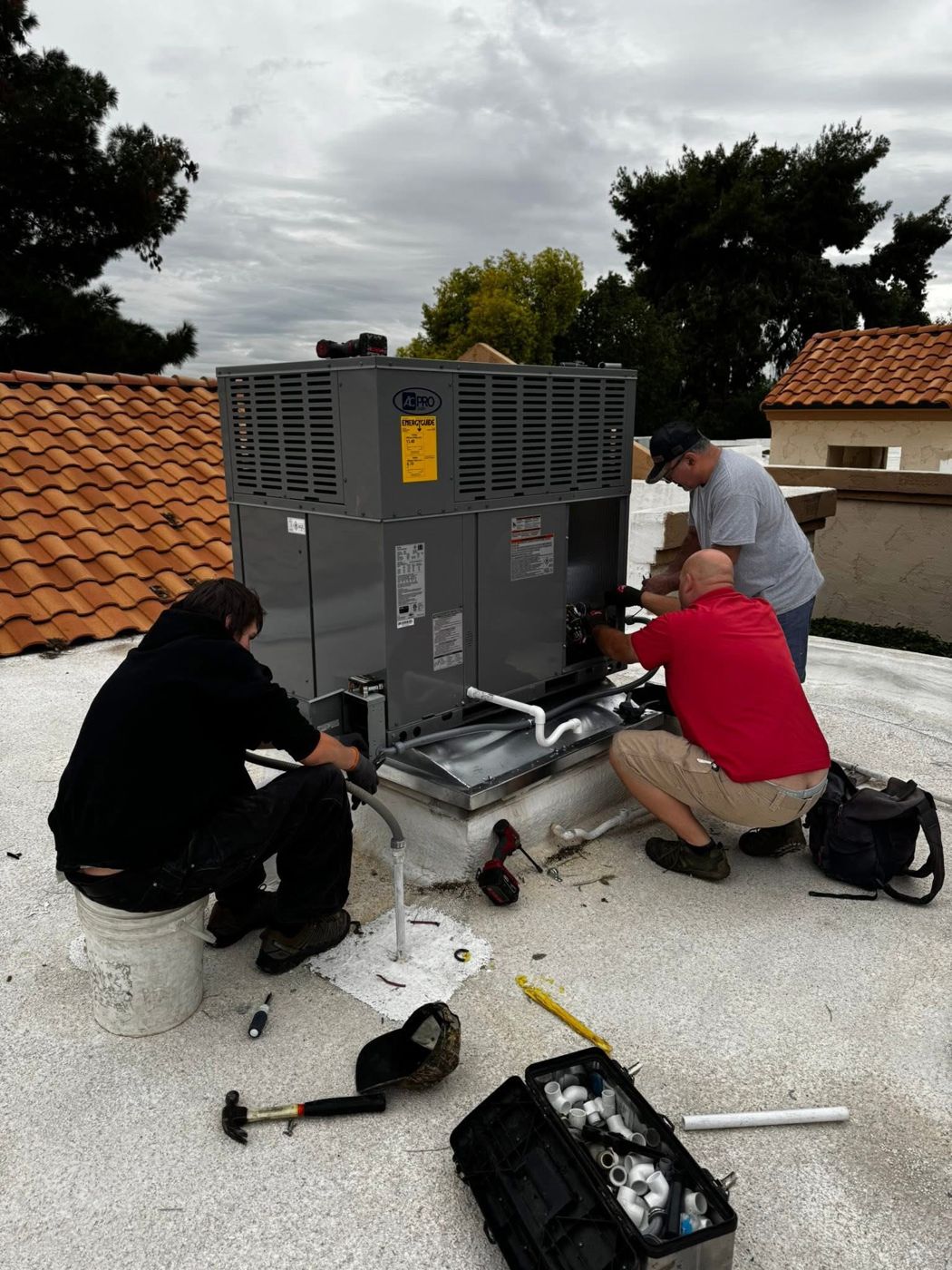 Noble crew working on a rooftop package unit