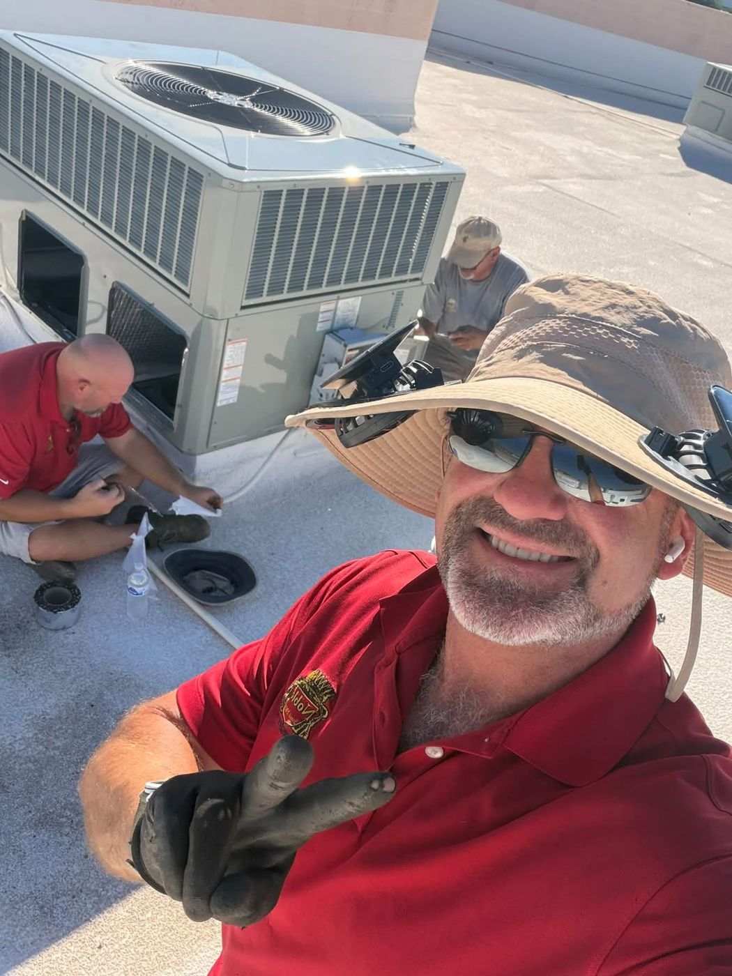 Noble technicians servicing a rooftop unit